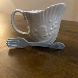 This is a Disney Parks The Little Mermaid 35th Anniversary Mug, with fork/spoon.